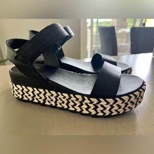 Size 8.5 platform Sorel sandals - black with black and white trim.